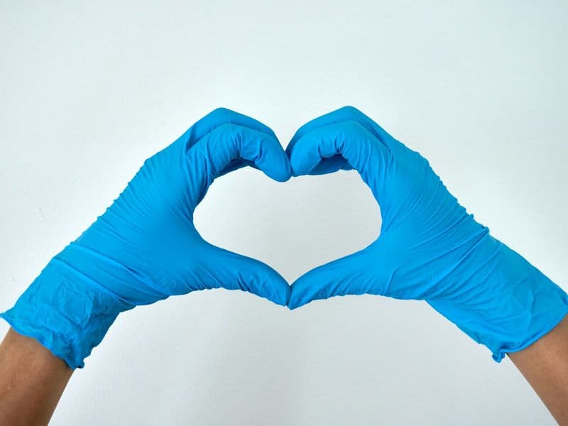 Cleaning gloves forming a heart, we care for your home